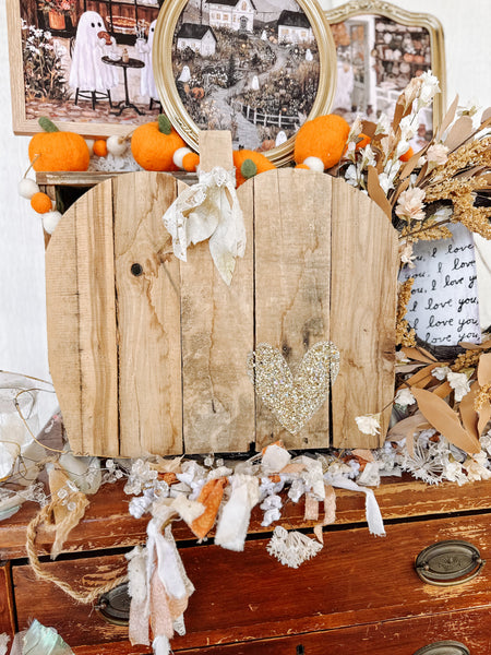 Olivewood’s 15” rustic wood pumpkin.